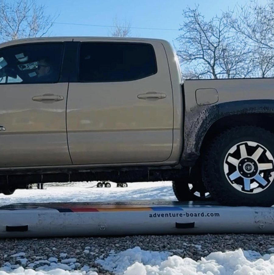Truck driving over Adventure Board Inflatable.