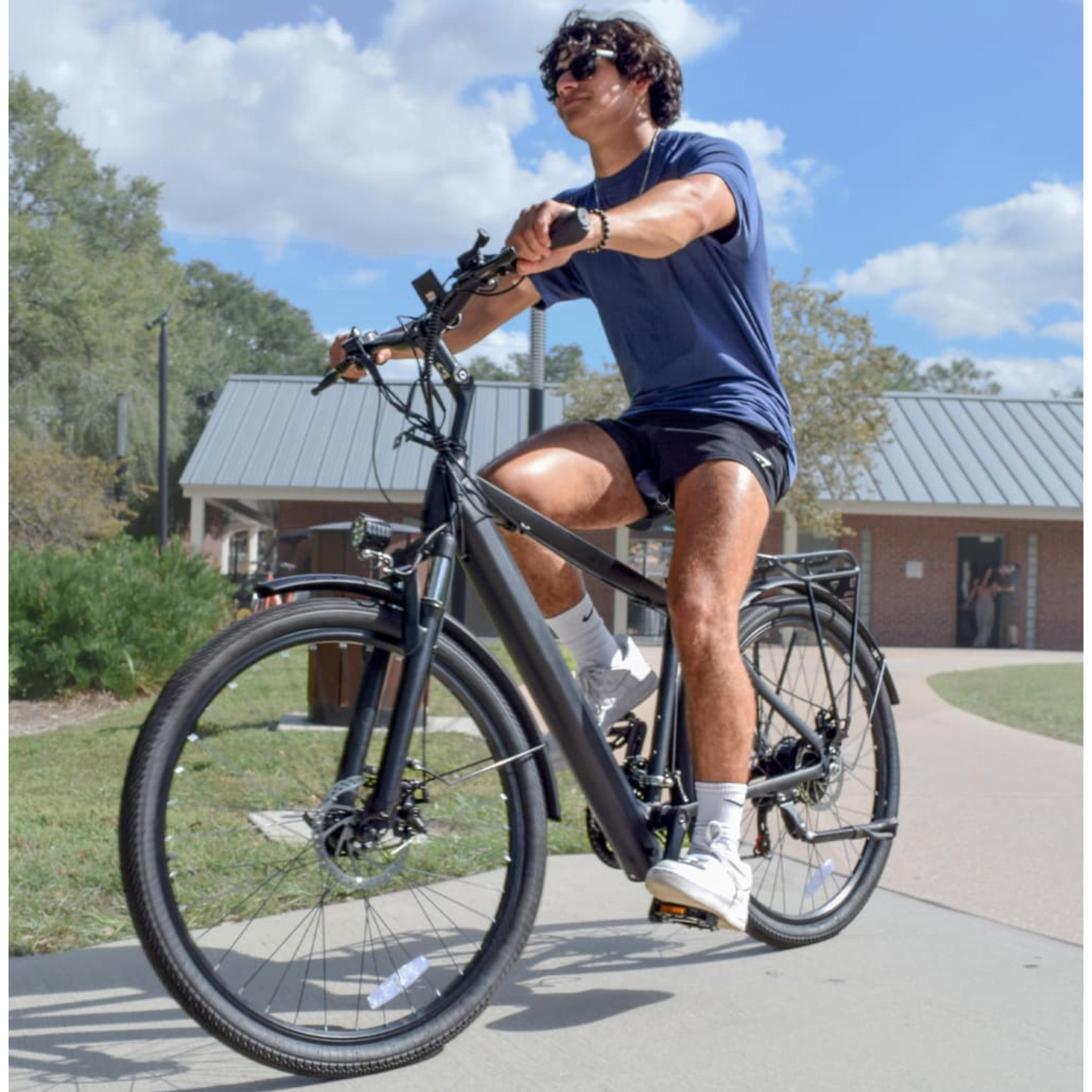 Guy riding his Jupiter Tempo City E-Bike.