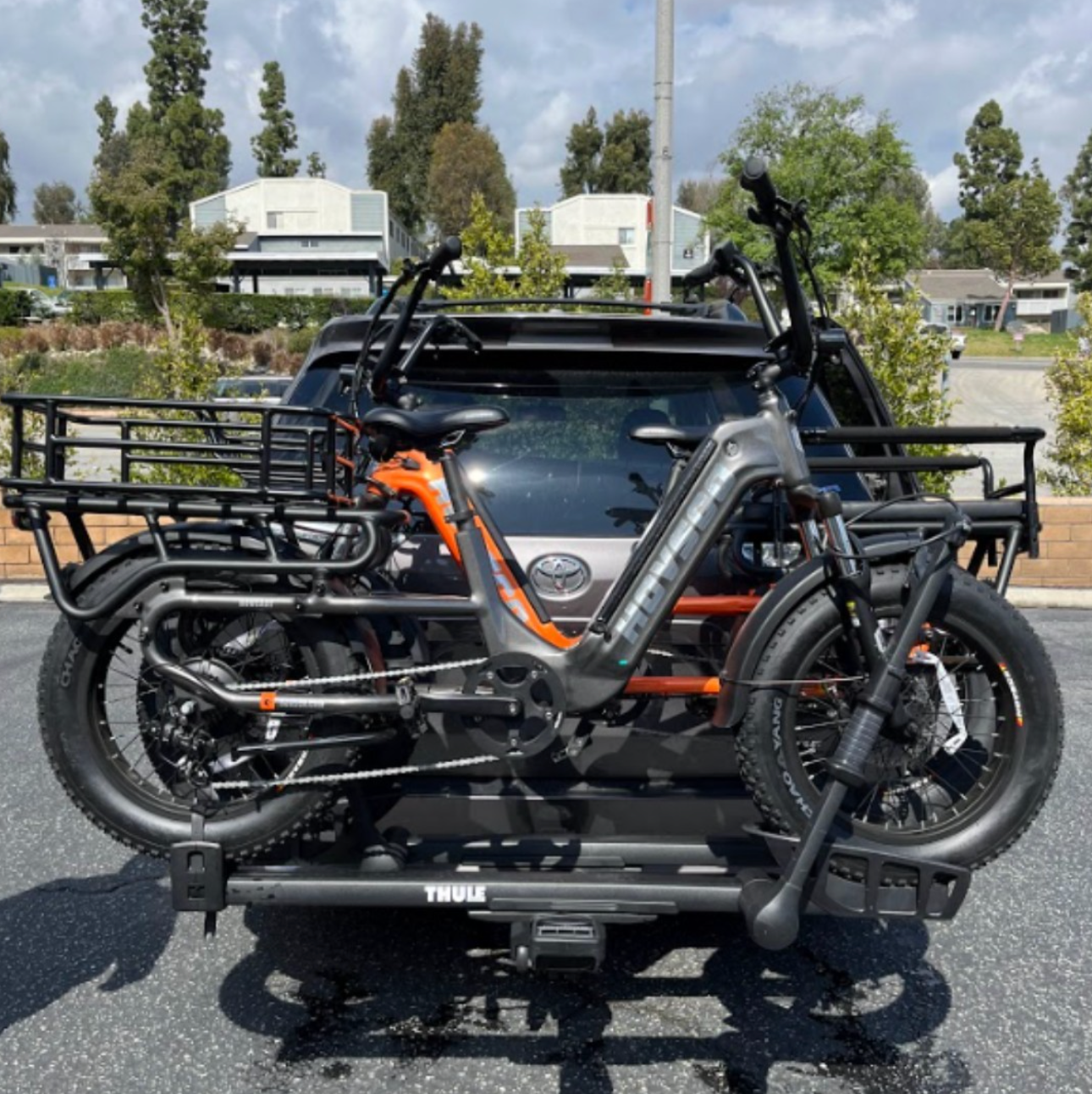 Two HOVSCO HovCart's on a bike carrier on the back of a Subaru.