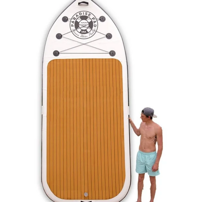 ParadisePad 12' Giant Party iSUP Paddle Board wth guy standing next to board.