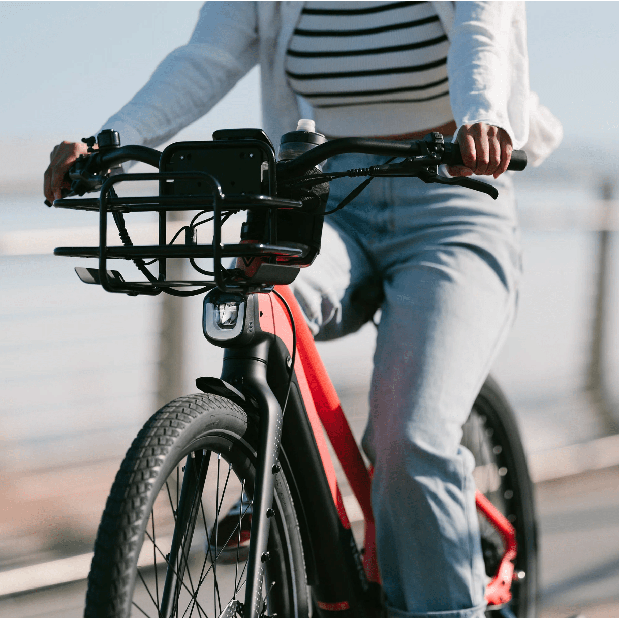 Woman riding Vvolt Alpha II Electric Bike.