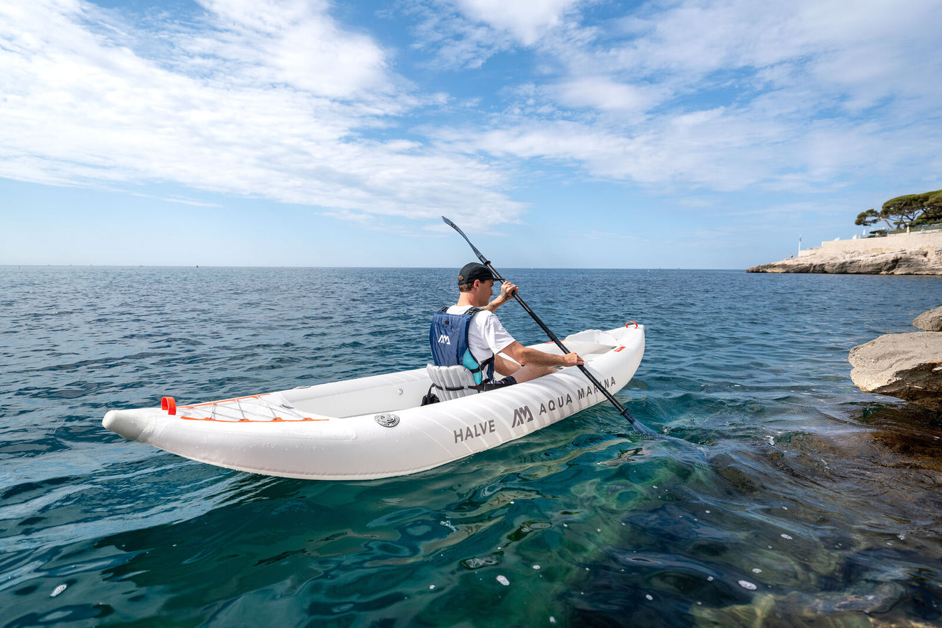 Guy paddling Aqua Marina Halve Inflatable Kayak. 