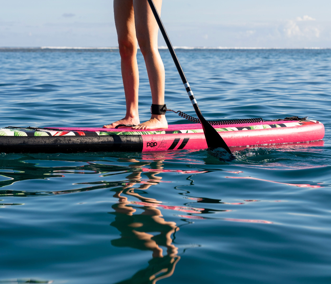 Girl on POP Board Co Royal Hawaiian Inflatable SUP.