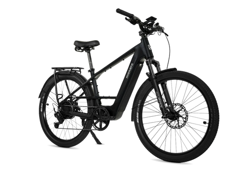 The Monarc Tracer High-Step electric bike in the color called Taconite with a rear cargo rack, fenders, and disc brakes, shown from a three-quarters angle on a white background.