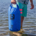 NIXY Dry Sack Man Holding 20 LIter While Standing In Water