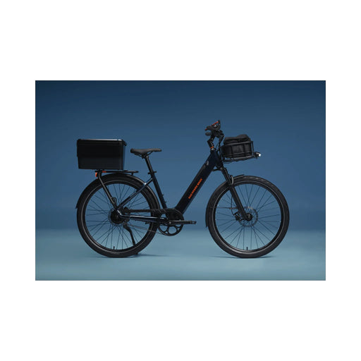 Rad Power Bikes RadKick side view with baskets and blue background.