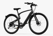 An Urtopia Carbon Classic Step-Over in matte black electric bike set at an angle on a white background.