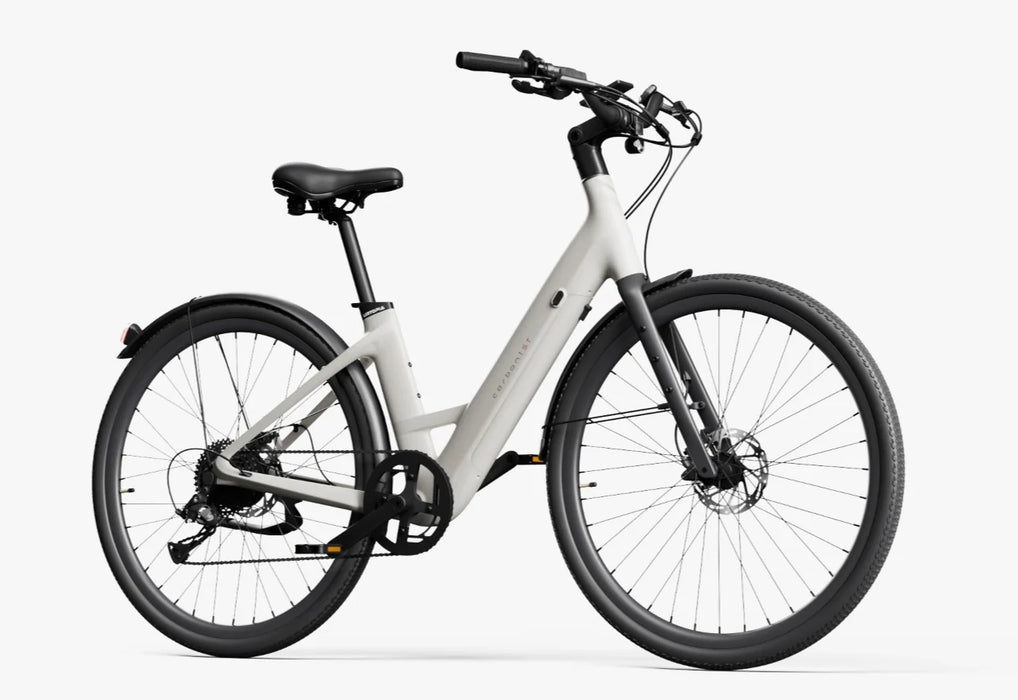 A creme Urtopia Carbon Classic Step-Thru electric bike at an angle on a white background.