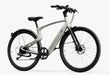 Creme electric bike by Urtopia called the Urtopia Carbon Classic in a Step-Over frame set at an angle on a white background.