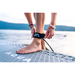 Girl strapping on Aqua Marina Glow SUP ankle safety leash. 