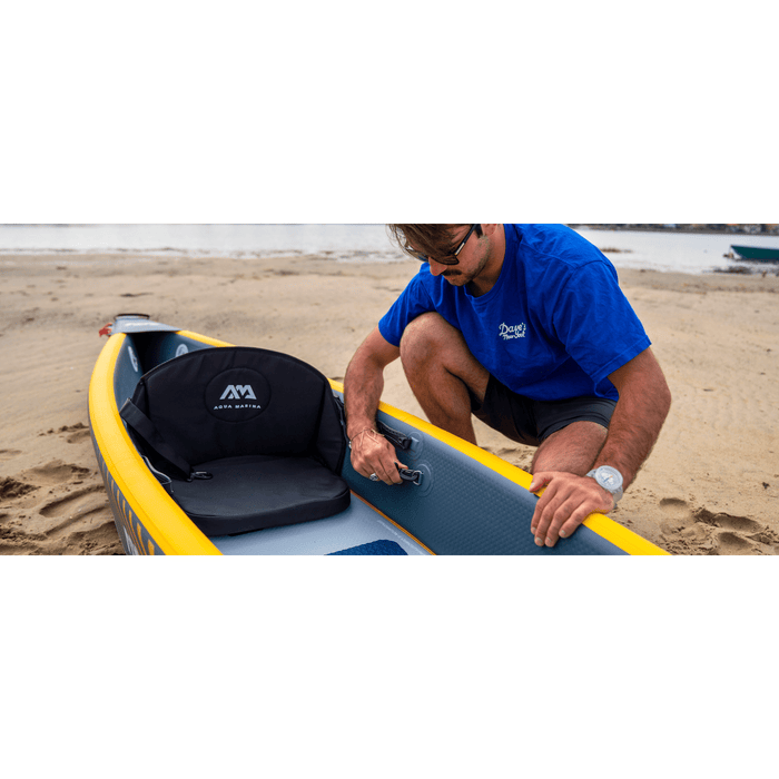 Guy checking Aqua Marina Tomahawk Air-K 440 Inflatable Kayak on beach.