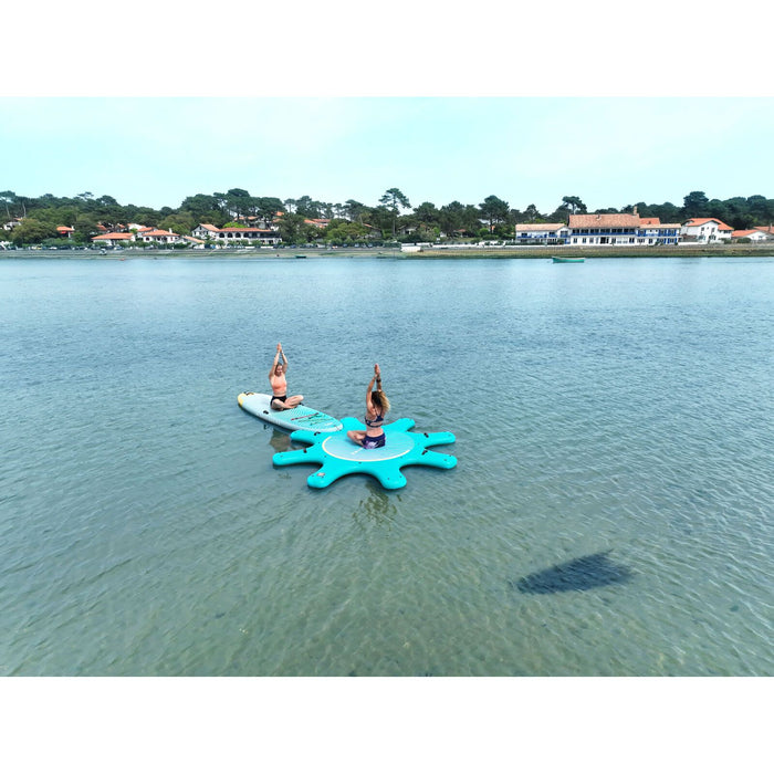 Arial view of girls sitting on Aqua Marina's Yoga Dock and Dhyana Fitness SUP. 