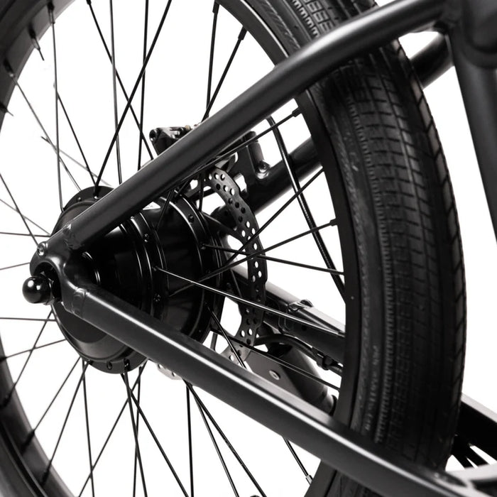 Close up image of a black JackRabbit OG2 e-Bike's rear wheel.
