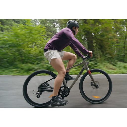 Guy riding ENVO Stax Electric Road Bike.