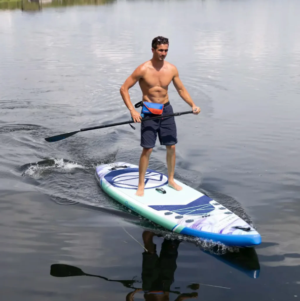 Guy paddling on Jimmy Styks Tracker iSUP out on the water.