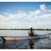 Oru Kayak Coast XT on the water with man paddling.