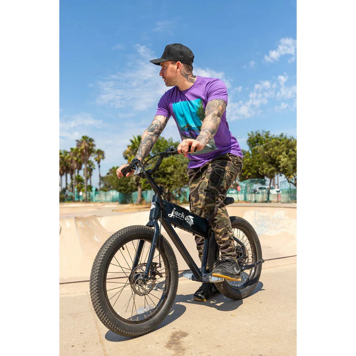 Guy in a bike park sitting on a black JackRabbit XG.