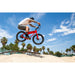Guy in the air riding a red JackRabbit XG with shorts on and Nike sneakers.