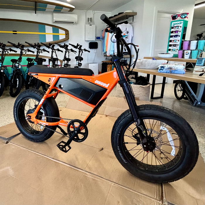 Juiced Scrambler Hardtail eBike in Orange Juice at Current Riders in Fort Myers Beach