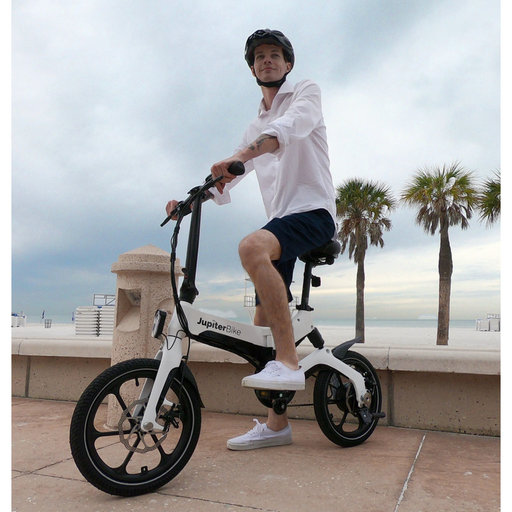 Guy at the beach on Jupiter X5 folding ebike.