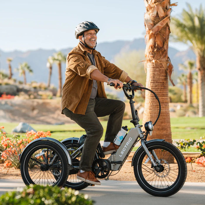  Guy riding Lectric Electric XP Trike on bike path.