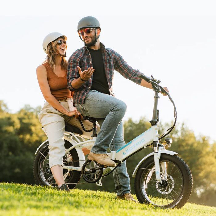 Couple on a Lectric XP Step-Thru 3.0 White eBike.