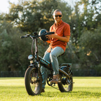 Guy with boots on a Lectric XP Step-Thru 3.0 Black Long-Range eBike.