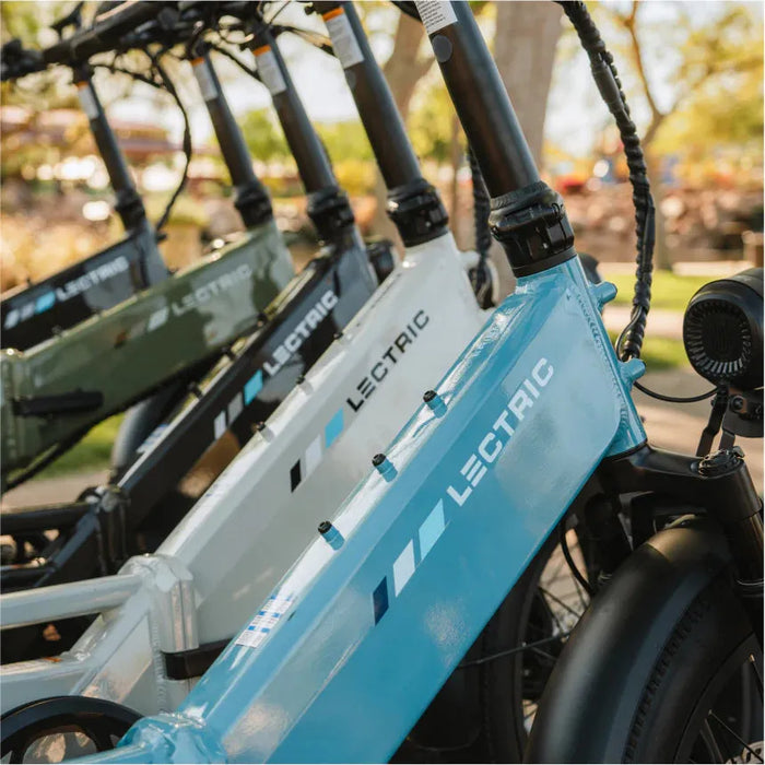 Lectric XP4 electric bikes in all available colors parked together.
