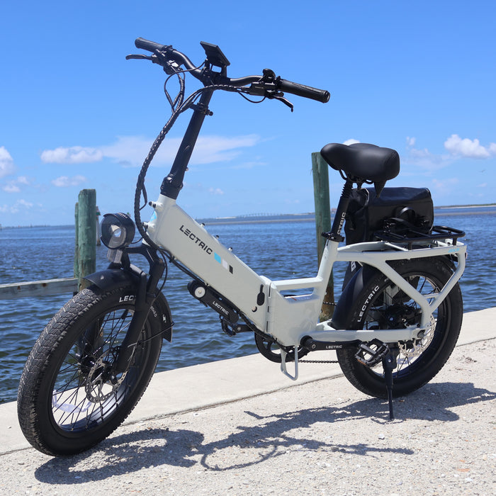 Lectric XP4 Stratus White folding eBike on the Fort Myers Beach waterfront.