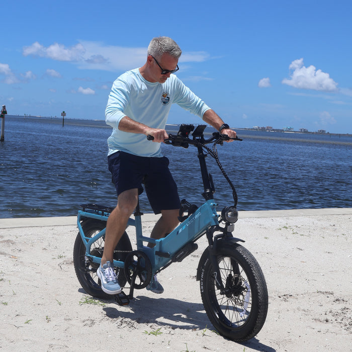 Brian test riding a Lectric XP4 folding eBike in Fort Myers Beach.
