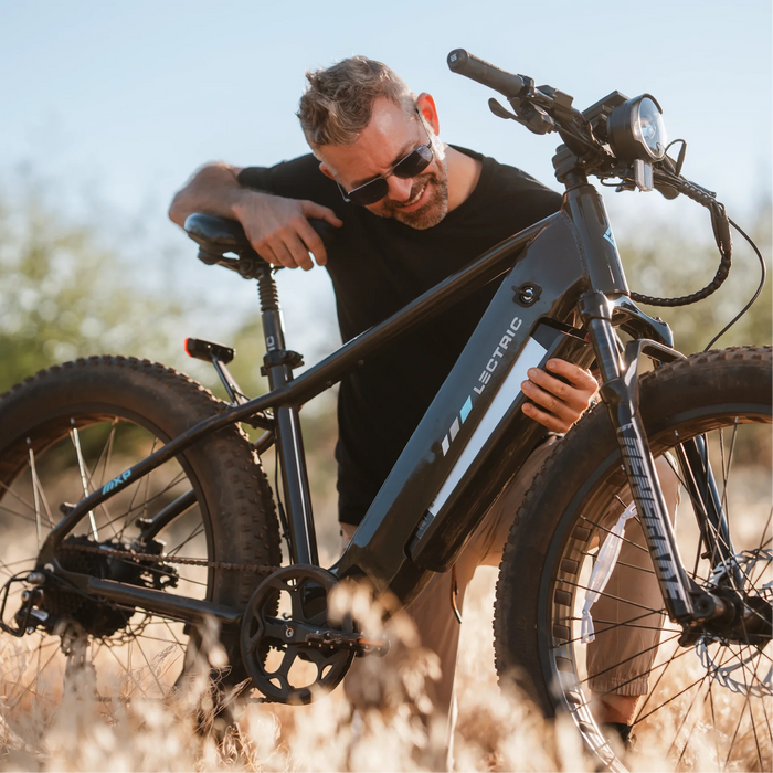 Changing the Lectric XPeak Step-Over 2.0 Electric Bike battery outside.