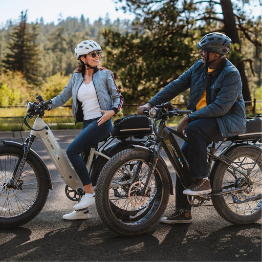 Couple on thier Lectric XPeak 2.0 electric bicycles. 