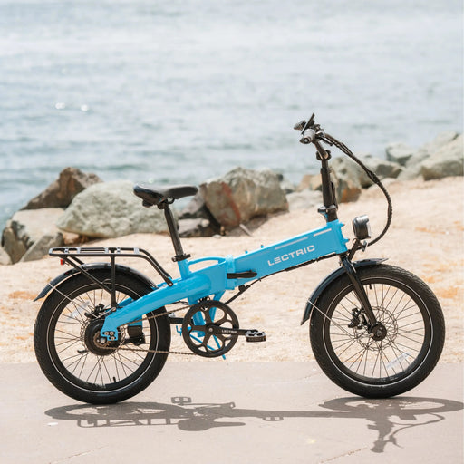 Lectric Blue XP 2.0 Lite ebike parked beachside.