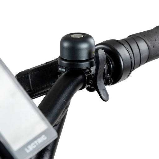 Lectric eBike Bell installed on handlebars of bike.