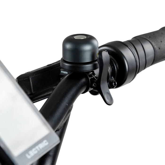 Lectric eBike Bell installed on handlebars of bike.