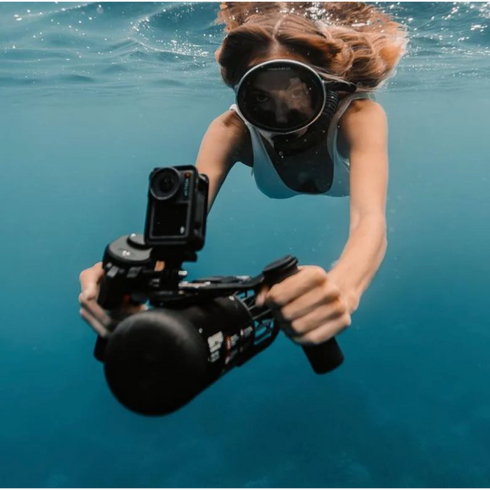 Woman using the LEFEET S1 while snorkeling underwater.