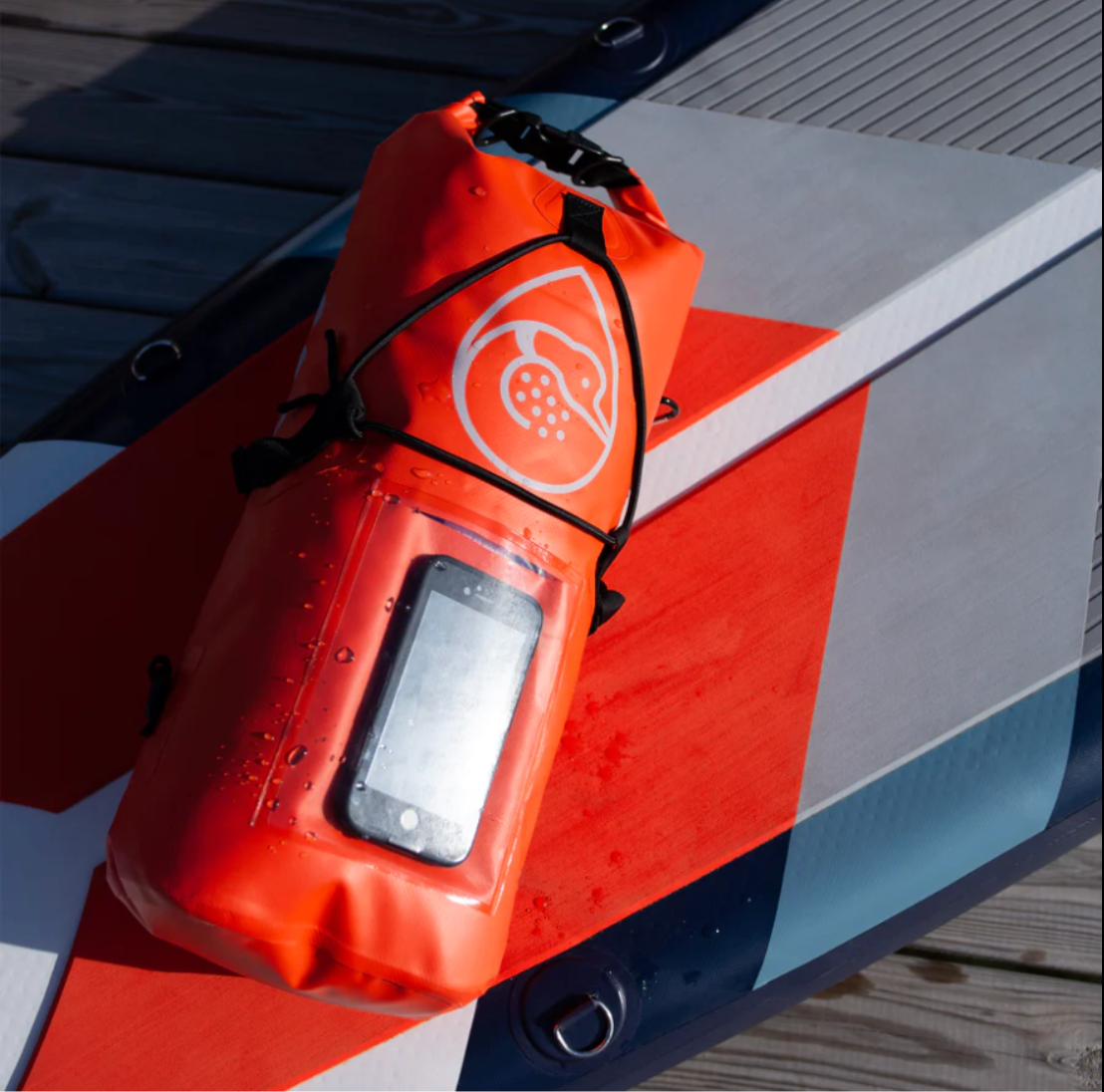 Loon Paddle Company 15 Liter Dry Bag on iSUP and dock. 