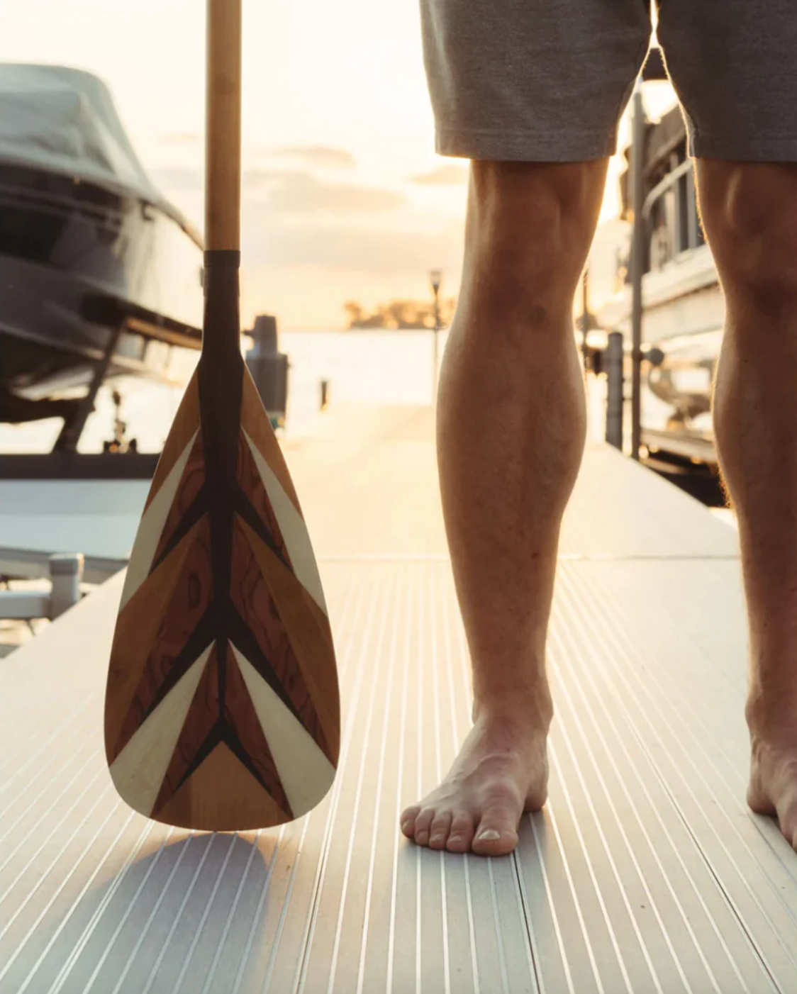 Loon Paddle Company Carbon & Bamboo Feather Paddle Man Standing On Dock With Paddle