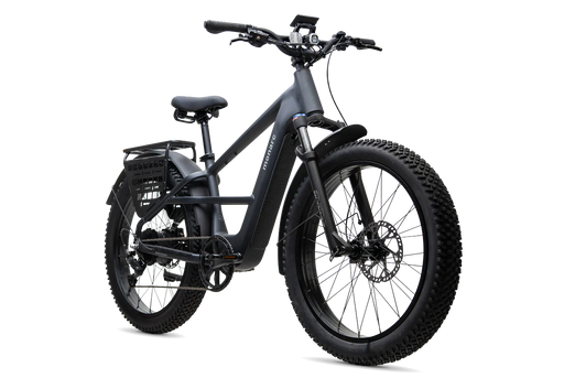 A Monarc Marker high step in a matte dark gray called Taconite electric fat tire bike with a rear cargo rack, fenders, and a digital display on the handlebars, shown on a solid white background.