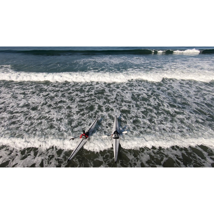 Two Oru Kayak Coast XT Kayak in breaking waves.