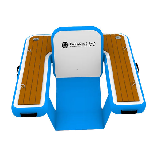 Inflatable floating chair with faux wood surface and blue frame, featuring 'Paradise Pad' branding.