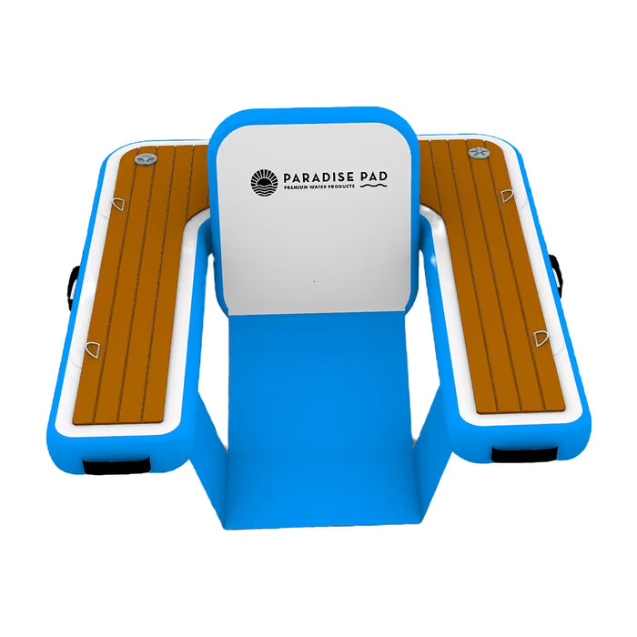 Inflatable floating chair with faux wood surface and blue frame, featuring 'Paradise Pad' branding.