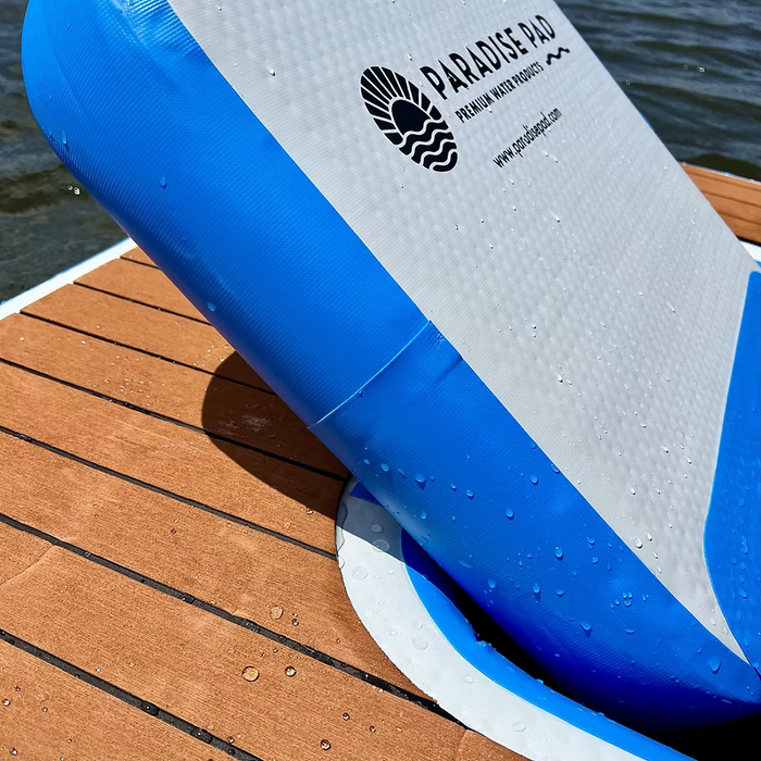 ParadisePad's blue and white inflatable floating chair with  water in the background