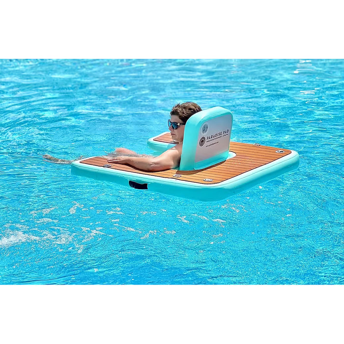 Person sitting in ParadisePad Inflatable Chair in a pool