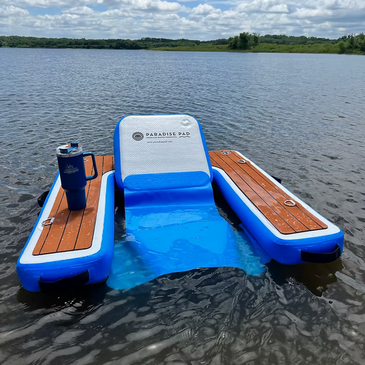 Inflatable floating lounge chair with faux wooden armrests floating on water, branded 'ParadisePad'.