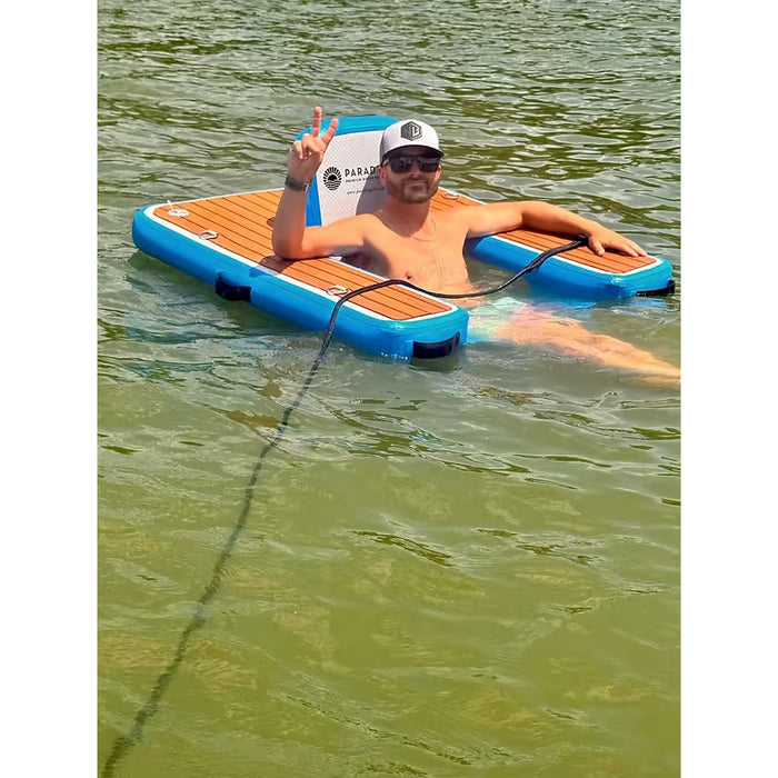 Man sitting in a ParadisePad Floating Chair in the water