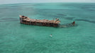 POP Board Co. Royal Hawaiian iSUP paddling around shipwreck. 