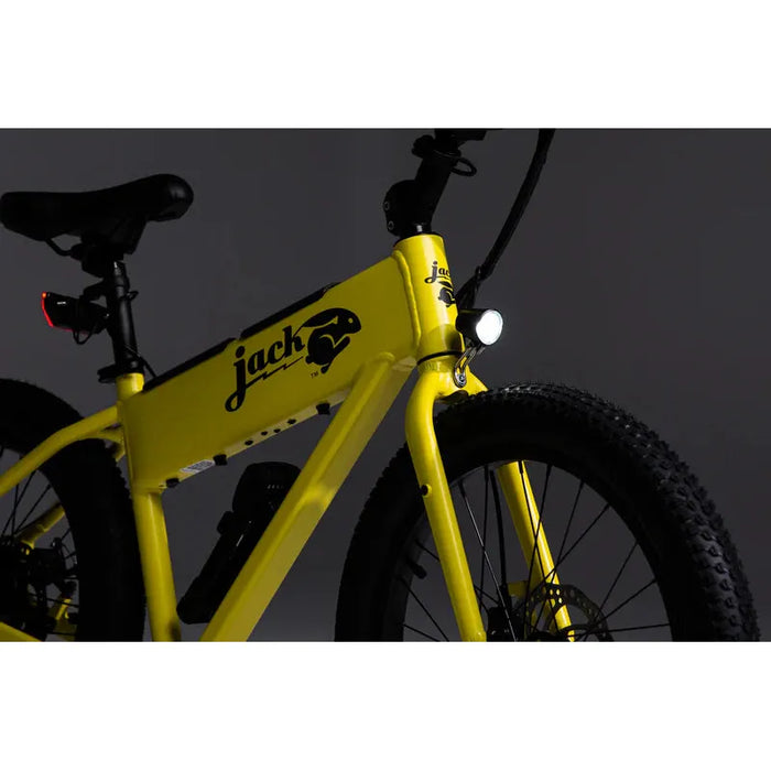 Product image of a yellow JackRabbit XG with the front light on.