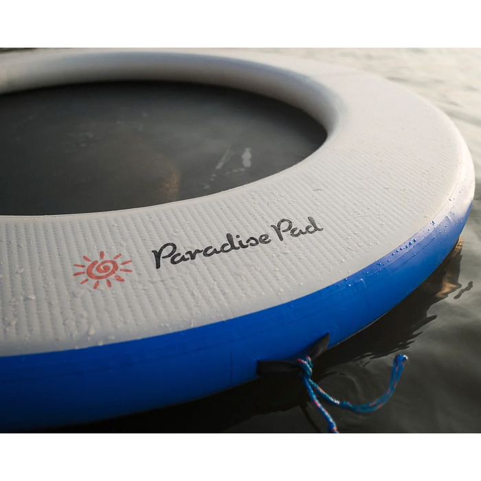 Close view of ParadisePad Round Island Inflatable Water Pad in water. 