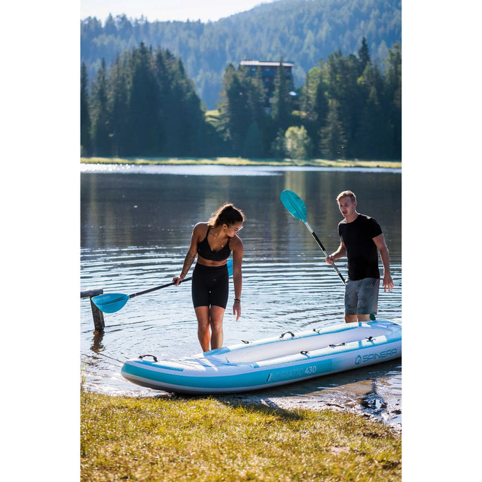 Couple getting ready on the shoreline to take a Spinera Adriatic 140 Kayak out on the water.